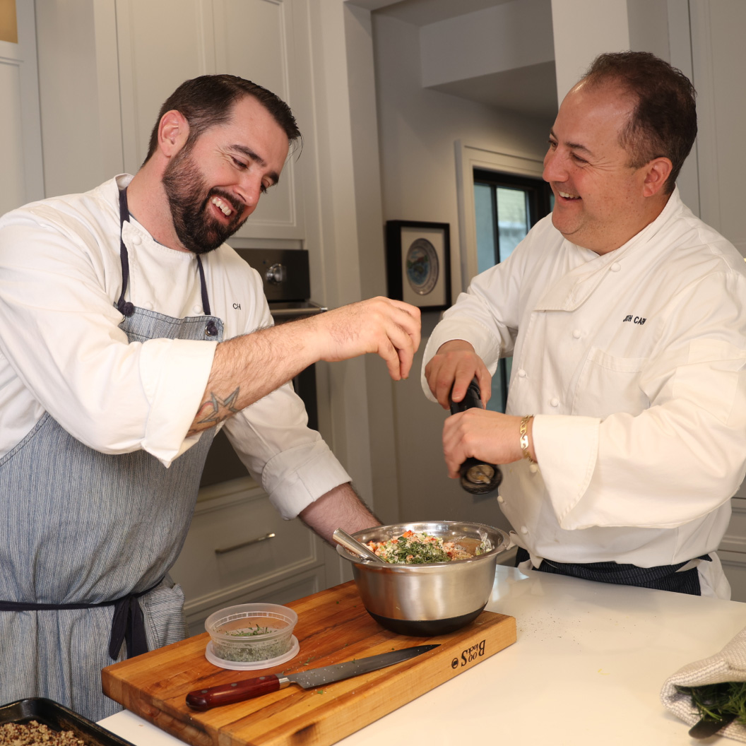 Capon cooking with another chef.